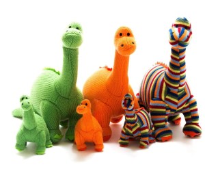 Small green, orange and stripe knitted stegosaurus dinosaur baby rattles